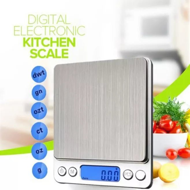 Digital electronic kitchen scale with measurement unit options on a blurred background of vegetables.